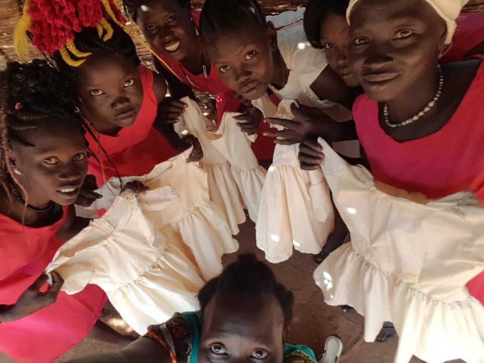 Mothers Sewing Union showing dresses they've made.