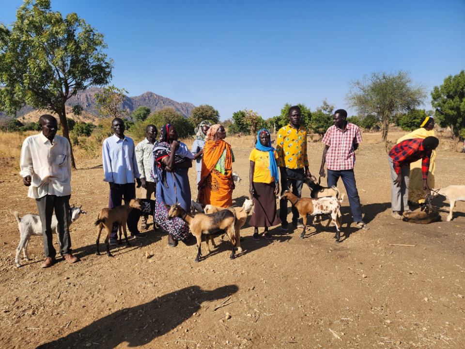 Recipients of the GOATS project with their goats