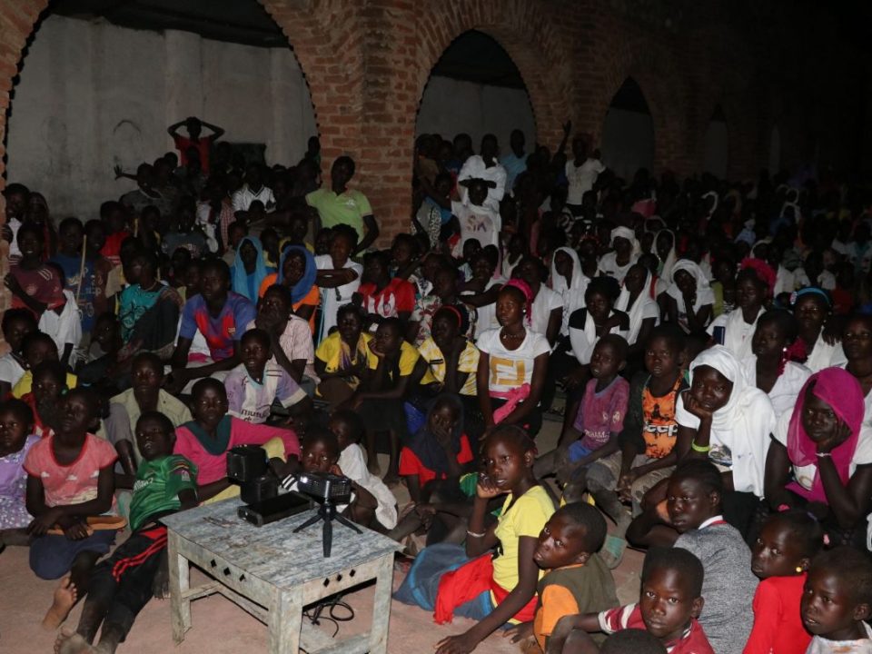 A group watches the Jesus Film