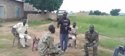 Evangelist doing outreach at an army post in Katcha archdeaconry