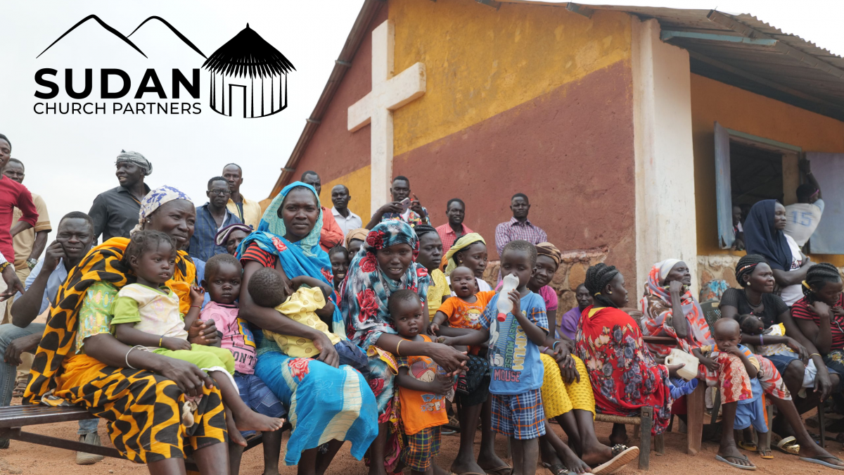 Sudanese people outside a church in the Nuba Mountains